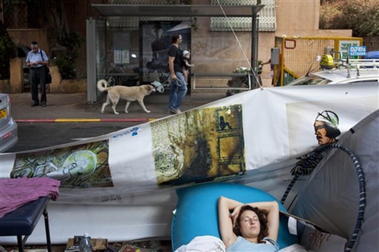 A woman sleeps in a protest tent encampment against the costs of living in Tel Aviv, Israel, on Aug. 2. What started out as a sprinkling of tents pitched along Tel Aviv's tony Rothschild Boulevard — named for a scion of the fabulously wealthy Jewish banking family — has swollen into the most ferocious popular outcry in decades. Initially targeting soaring housing prices, it quickly morphed into a sweeping expression of rage against a wide array of economic issues